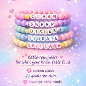 May include: Stack of pastel-colored beaded bracelets with words like "CLEAN" and "SELF CARE". The image includes text: "Your brain isn't broken, it just needs support." and "little reminders for when your brain feels loud."