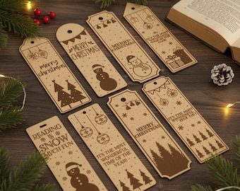 May include: A collection of Christmas-themed bookmarks made of light brown wood. Each bookmark features festive designs such as snowmen, Christmas trees, ornaments, and the text "Merry Christmas" and "It's the most wonderful time of the year!"