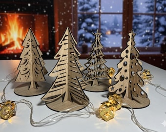 May include: A collection of wooden Christmas tree decorations in various designs. The trees are light brown with cut-out patterns and sit on round bases. A string of gold geometric lights is in the foreground, with a fireplace and snowy window in the background.