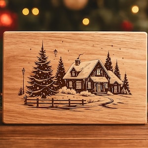May include: A wooden plaque with a detailed engraving of a house nestled among pine trees, a fence, and a winding path. The artwork is in a rustic style, perfect for holiday decor.