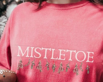Camiseta con estampado de muérdago, estilo vintage, colores cómodos, para invierno.