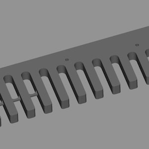 May include: A gray, rectangular woodworking jig with evenly spaced slots and two circular holes. The jig is designed for creating precise cuts in wood for joinery or other woodworking projects.
