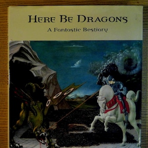 May include: A book cover with a green dragon and a knight on a white horse. The book title is "Here Be Dragons" and the subtitle is "A Fantastic Bestiary".