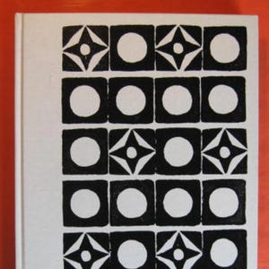 May include: A black and white geometric pattern with repeating circles and stars. The pattern is made up of a grid of squares, each containing a circle or a star.