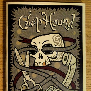 May include: A poster with a skull, scissors, and a telephone. The skull is white with gray swirls and a red ribbon. The scissors are silver, and the telephone is off-white. The text "Crop Hound" is at the top.