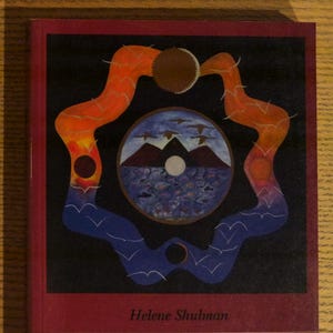 May include: A book titled "Living at the Edge of Chaos" by Helene Shulman. The cover features a dark background with an abstract design in orange, blue, and brown. The book's title and author's name are in white text.
