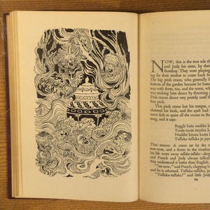 May include: An open book with a black and white illustration on the left page. The illustration depicts a detailed scene with swirling lines, a pagoda-like structure, and figures. Text is visible on the right page.