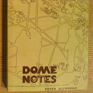 May include: A book cover with a tan background and brown text and illustrations. The title "DOME NOTES" is prominently displayed. The cover features a geometric design and silhouettes of figures. The author's name, Peter Hjersman, is at the bottom.
