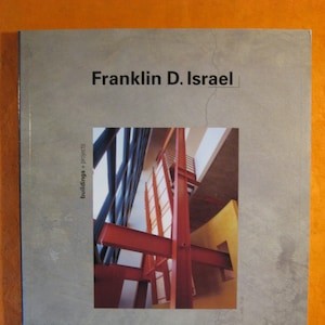 May include: A book titled "Franklin D. Israel" with a gray cover. The cover features a photograph of a building's interior with red beams and architectural details. The book's title is in black text, and the publisher's logo is in the bottom right corner.