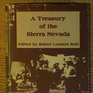 May include: A book cover with the title "A Treasury of the Sierra Nevada" and the text "Edited by Robert Leonard Reid". The cover features a sepia-toned photograph of a group of people standing in front of a tent.