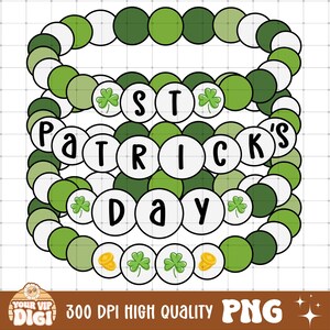 May include: Four layered green, white, and gold beaded bracelets with the words "St. Patrick's Day" on them.
