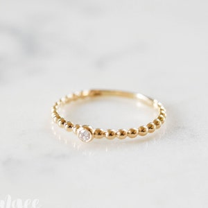 anel de diamante maciço com contas de OURO 14K. tamanho 6