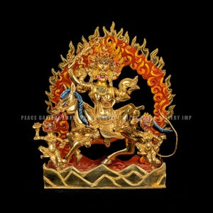 May include: A golden statue of a deity riding a horse, surrounded by flames. The deity holds a sword and is flanked by two smaller figures. The statue is set against a black background. The text "PEACE GALLERY IMP" is visible.