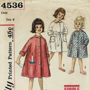 May include: A vintage sewing pattern for children's robes. The pattern is for sizes 6 and includes three different styles. The pattern is from Simplicity and is labeled as "Simple to Make".