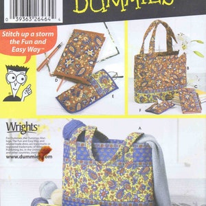 May include: Sewing pattern for a tote bag and accessories. The pattern includes instructions for making a tote bag, a book cover, a glasses case, and a tissue holder. The pattern is for Dummies and features a floral print in shades of blue, yellow, and red.
