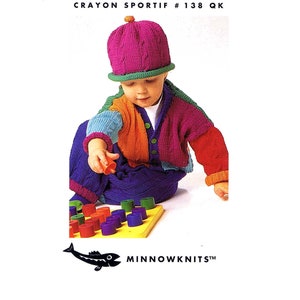 May include: A colorful knitted cardigan and matching hat for a baby. The cardigan has a rainbow color scheme with a green, blue, orange, and pink pattern. The hat is a solid pink color with a green brim. The image includes the text "Crayon Sportif # 138 QK" and "Minnowknits".