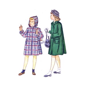 May include: Two girls wearing coats. The girl on the left is wearing a plaid coat with a hood and carrying a book. The girl on the right is wearing a green coat with a white hat and carrying a purse.