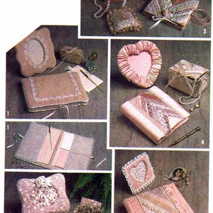 May include: A collection of 10 handmade craft projects featuring various designs and materials. The projects include a heart-shaped picture frame, a small box with a heart-shaped lid, a small box with a round lid, a small box with a square lid, a small box with a rectangular lid, a small box with a rectangular lid, a small box with a rectangular lid, a small box with a rectangular lid, a small box with a rectangular lid, and a small box with a rectangular lid.