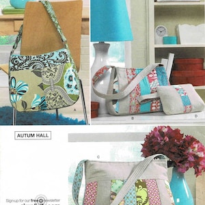 May include: Simplicity sewing pattern number 2617 for making three different bags. The bags are made from patchwork fabric in shades of blue, green, pink, and brown. The pattern includes instructions for making a large tote bag, a smaller shoulder bag, and a small clutch.