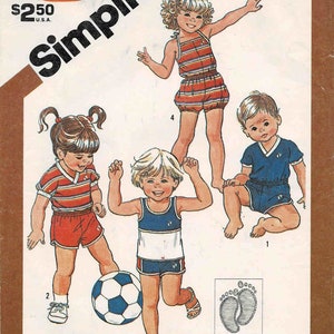 May include: Simplicity sewing pattern number 5953 for toddler sized clothing. The pattern includes instructions for making a blue and white striped tank top and shorts, a red and white striped t-shirt and shorts, and a blue tank top and shorts. The pattern is sized for stretch knits only and includes a yellow wax transfer for embroidery.