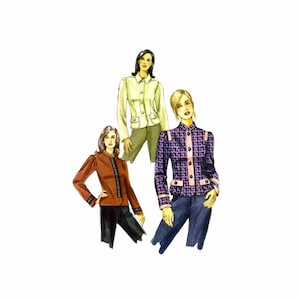May include: Three women wearing different jackets. The woman on the left is wearing a brown jacket with black trim. The woman in the center is wearing a light green jacket with black trim. The woman on the right is wearing a purple and black patterned jacket with pink trim.
