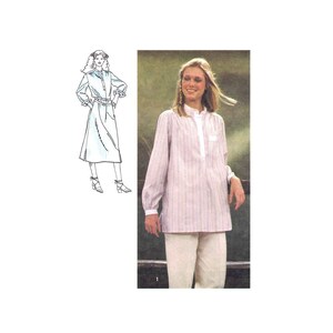 May include: A striped, long-sleeved blouse with a mandarin collar and a button-up front. The blouse is worn with white pants.