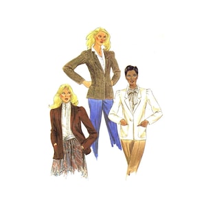 May include: Three women wearing different styles of blazers. The woman on the left is wearing a brown blazer with a white blouse, the woman in the middle is wearing a brown blazer with a white blouse and blue pants, and the woman on the right is wearing a white blazer with a white blouse and brown pants.