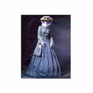 May include: A woman wearing a long, blue skirt and a green jacket with gold accents. She is wearing a white hat with a yellow brim and a white veil. The background is a dark, textured surface.