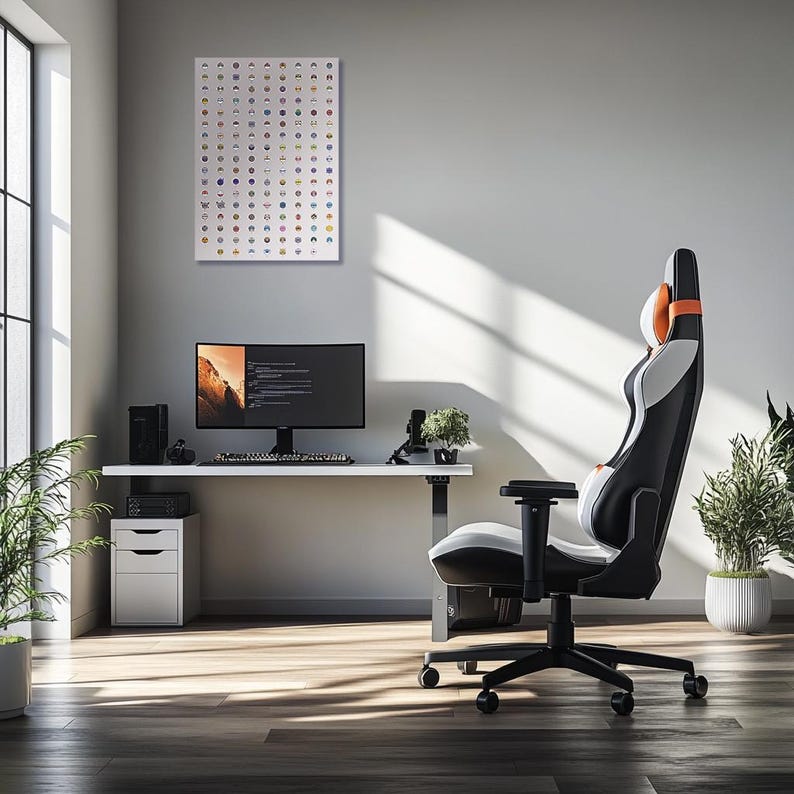 May include: A white desk with a black computer monitor, a keyboard, and a black and orange gaming chair. The desk is against a white wall with a framed print of a grid of colorful icons.