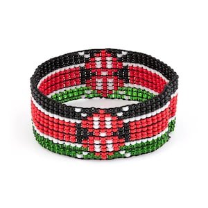 May include: A wide cuff bracelet crafted from small glass beads arranged in a repeating geometric pattern. The design features horizontal stripes of black, red, white, and green beads, creating a vibrant, multi-colored, and textured surface.