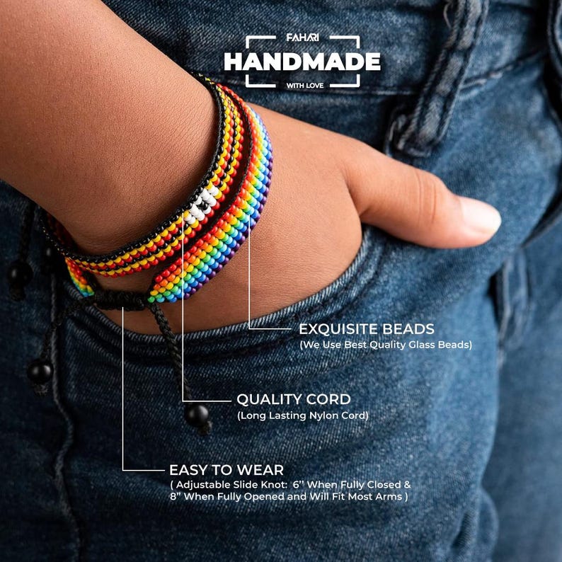 May include: A rainbow beaded bracelet with a black cord and adjustable slide knot. The bracelet is handmade with high-quality glass beads and a long-lasting nylon cord. It is 6 inches when fully closed and 8 inches when fully opened, making it suitable for most arm sizes.