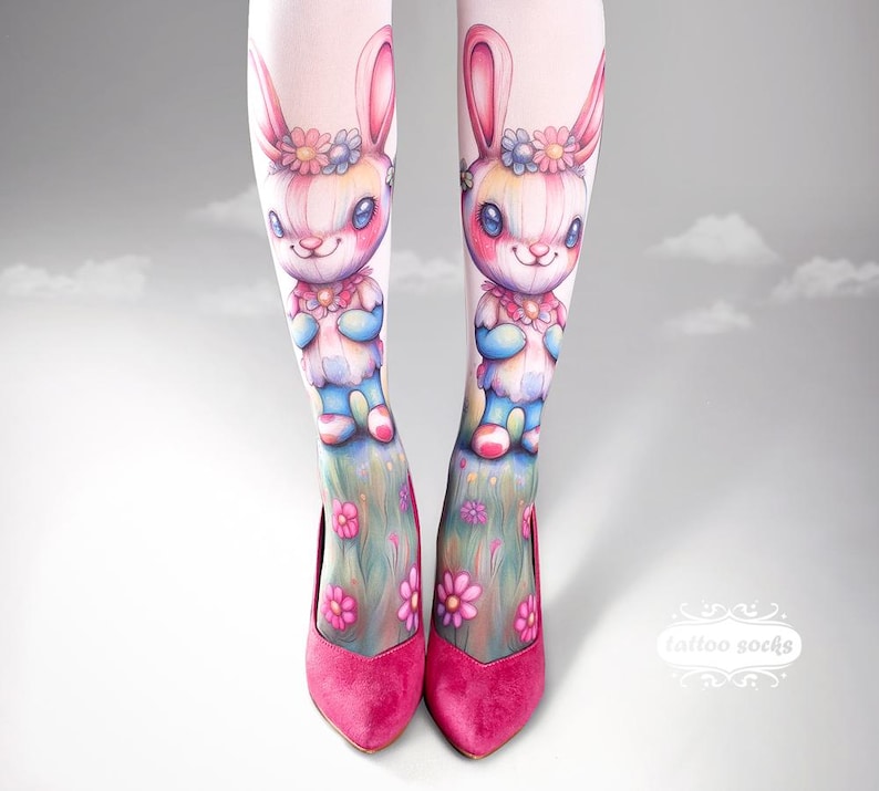 May include: Pink tights with a bunny illustration and pink heels. The bunny design features a floral crown and a colorful outfit. The heels are a vibrant pink color, and the tights have a floral design at the bottom.