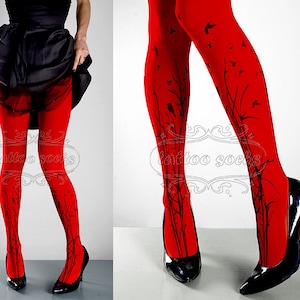 May include: Red tights with a black floral and bird design. The tights are worn by a person with black heels.