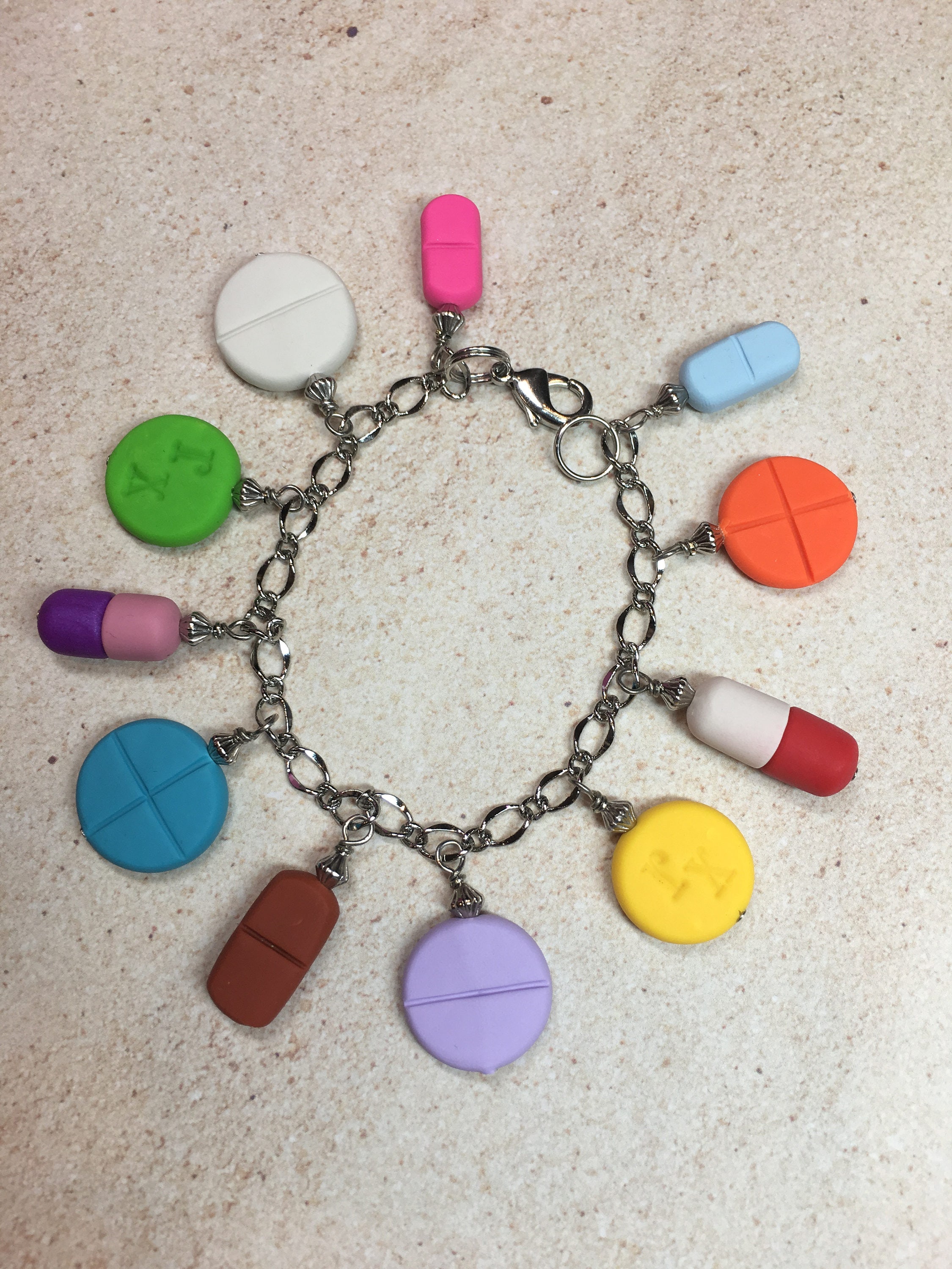 Pill charm bracelet deals