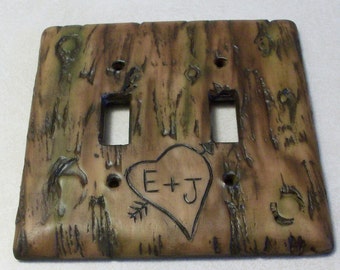 Carved love initials in a Bark of a tree light switch cover