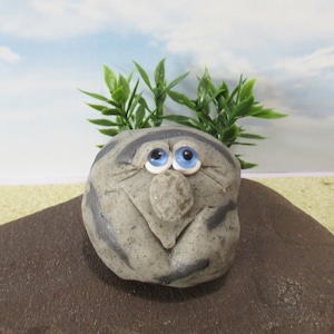 Hand sculpted gray rock guy for planters or gardens