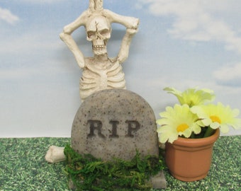 Miniature RIP headstone with yoga skeleton