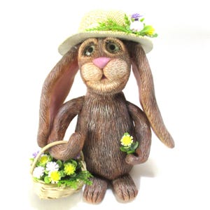 Ms Bunny shopping for flowers figurine