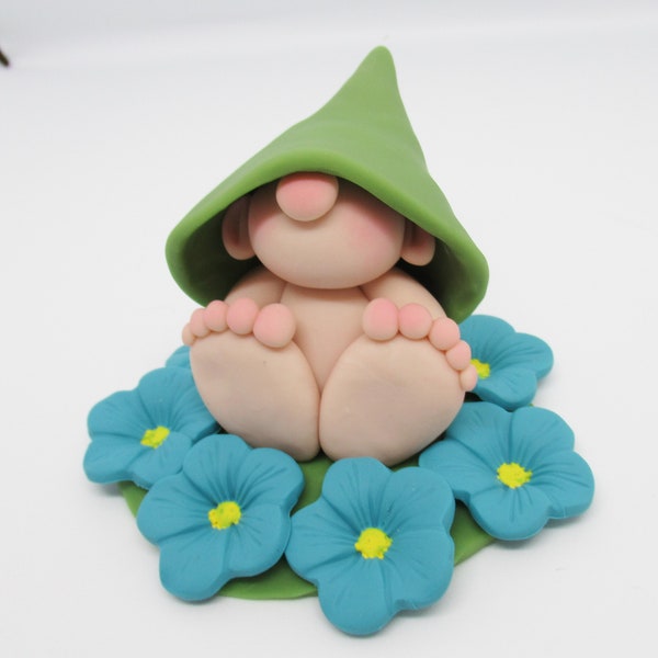 Gnome figurine with circle of blue flowers, polymer clay figurine