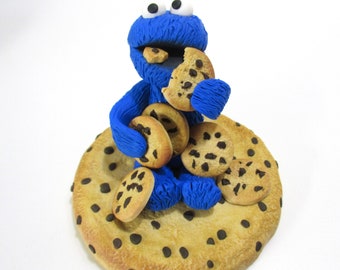 Cookie monster chomping on cookies figurine