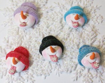 Snowman ornament catching a snowflake on his tongue: polymer clay snowman