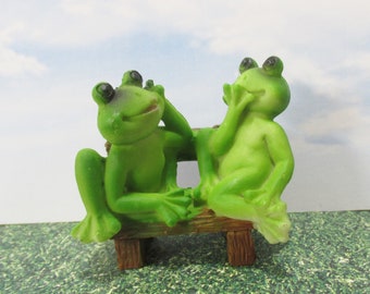 Sale Pair of miniature frogs gossiping on a park bench