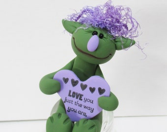 Green love monster with purple heart message figurine