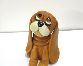 Cute golden brown dog figurine with long ears