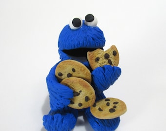 Cookie monster chomping on cookies figurine