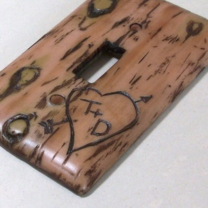 Carved love initials in a Bark of a tree light switch cover