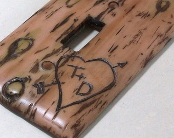 Carved love initials in a Bark of a tree light switch cover