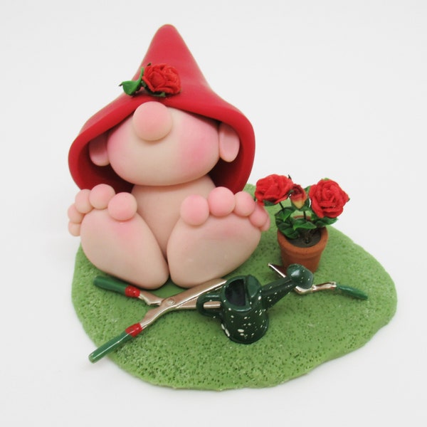 Gnome figurine and his roses and garden tools, polymer clay figurine