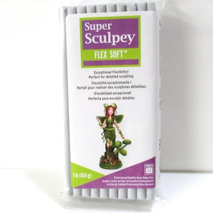 May include: A package of Super Sculpey Flex Soft polymer clay. The package features a purple and green label with the product name and a sculpted fairy. The package contains 1 lb (454 g) of clay.
