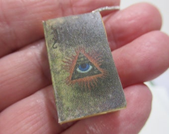 Miniature book necklace Past present and future